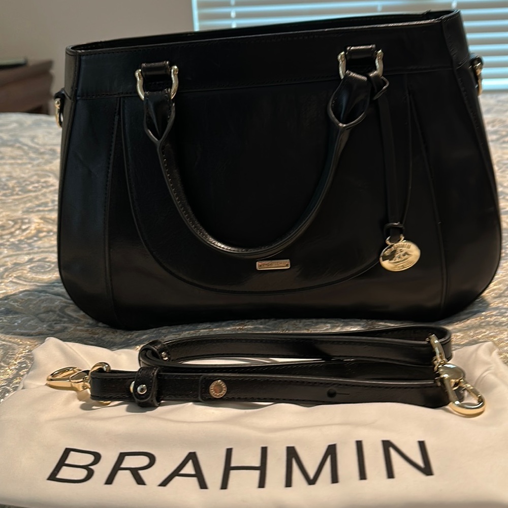 Black smooth leather Brahman.  Has crossbody strap.